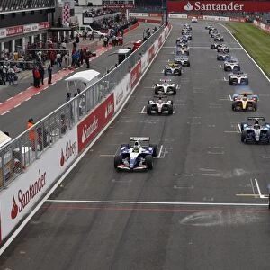 2009 GP2 Series. Round 4. Silverstone, England: Romain Grosjean leads the field of the start line. Action