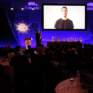 2014 BRDC Annual Awards The Grand Connaught Rooms, London, UK Monday 8 December 2014. Daniel Ricciardo accepts his Innes Ireland Trophy from the big screen. World Copyright: Ebrey/LAT Photographic. ref: Digital Image Ricciardo-01