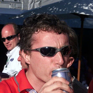AUSTRALIAN GRAND PRIX MELBOURNE 7TH MARCH 1999 GRAND PRIX WINNER EDDIE IRVINE ENJOYS A BEER AFTER HIS WIN PHOTO: LAWRENCE / LAT