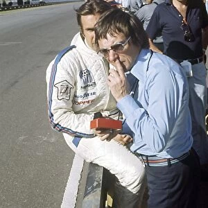 Buenos Aires, Argentina. 12 January 1975: Bernie Ecclestone and Carlos Reutemann, Brabham BT44B-Ford, 3rd position, on the pit wall, portrait