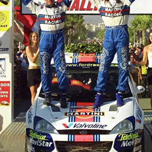 Colin McRae (R) & co-driver Nicky Grist (L) celebrate victory in the Cyprus Rally 2001. Photo:McKlein