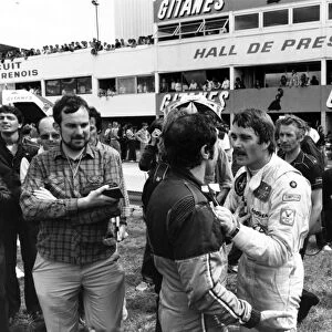 Dijon-Prenois, France. 3-5 July 1981: Nigel Mansell, 7th position, squares up to fellow Brit, Brian Henton, NQ, after qualifying, portrait