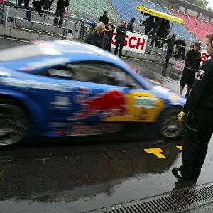 DTM: Karl Wendlinger, PlayStation 2 Red Bull Abt-Audi TT-R, practices a stop in the wet pitlane