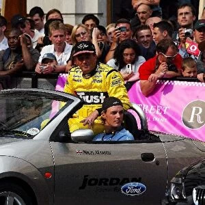 F1 Regent Street Parade: Nigel Mansell, who drove a Jordan, parades Regent Street in a Ford Street Ka