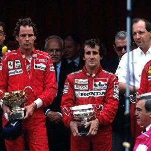 Formula 1 World Championship: Winner Alain Prost McLaren MP4 / 4, with 2nd placed Gerhard Berger Ferrari F187 and 3rd placed Michele Alboreto Ferrari