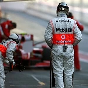 Formula One Testing: Kimi Raikkonen Ferrari F60 makes a pitstop watched by McLaren