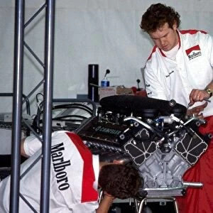 Formula One Testing: McLaren mechanics prepare the Chrysler / Lamborghini V12 that the team is evaluating
