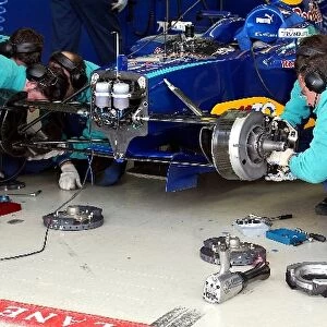 Formula One Testing: Sauber mechanics rebuild the brakes on a Sauber Petronas C23