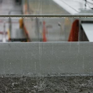 Formula One Testing: Water torrent off a roof