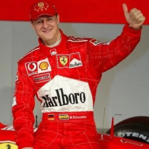 Formula One World Championship: 2002 F1 World Champion Michael Schumacher poses with the new Ferrari F2003-GA