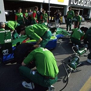 Formula One World Championship: The 7-Up Jordan team practice pitstops before the team makes its Grand Prix Debut