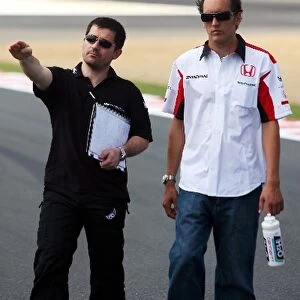 Formula One World Championship: Antonio Cuquerella Super Aguri F1Team Engineer and Franck Montagny Super Aguri F1 Team walk the circuit