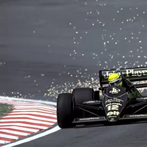 Formula One World Championship: Ayrton Senna Lotus 98T, who finished the race in second position, sends the sparks flying as he climbs Eau Rouge