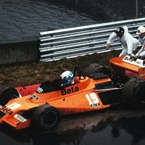 Formula One World Championship: Beppe Gabbiani Surtees TS20 is pushed back onto the circuit by marshals after spinning in the wet practice session