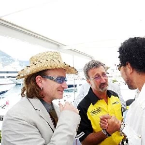 Formula One World Championship: Bono lead singer U2 with Eddie Jordan Jordan Team Owner and Lionel Richie singer