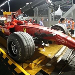 Formula One World Championship: The car of Kimi Raikkonen Ferrari F2008 is recovered after he crashed out of the race