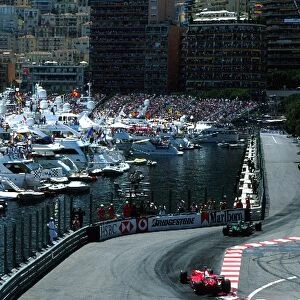 Formula One World Championship: The cars pass through the chicane and head alongside the harbour of Monaco