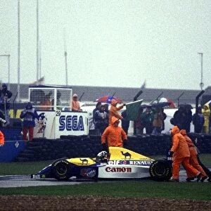 Formula One World Championship: Damon Hill, Williams FW15C, is pushed off the track by marshals
