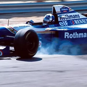 Formula One World Championship: David Coulthard Williams FW17 locks a wheel on the way to his first GP victory