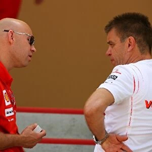 Formula One World Championship: David Lloyd Ferrari talks with Dr. Aki Hintsa McLaren team Doctor