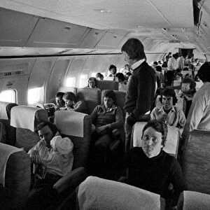 Formula One World Championship: Drivers and team personnel on board a flight to Sao Paulo, including Patrick Depailler Tyrrell, Ronnie Peterson Lotus