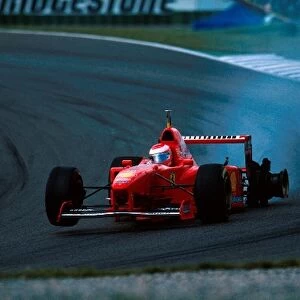 Formula One World Championship: Eddie Irvine Ferrari F310B retires with a puncture