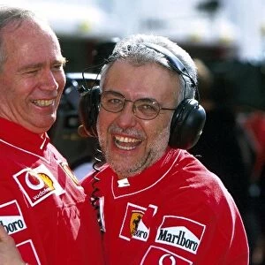 Formula One World Championship: Ferrari designer Rory Byrne and Stefano Govoni Head of Ferrari Customer Engines celebrate the teams 1-2 finish