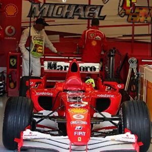 Formula One World Championship: Ferrari F248 F1 of Michael Schumacher Ferrari in parc ferme