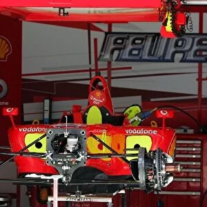 Formula One World Championship: Ferrari F248 F1 in the pits stripped down