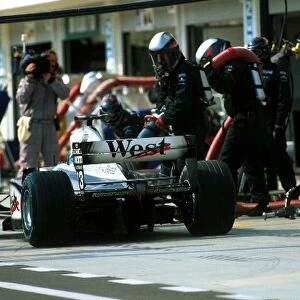 Formula One World Championship: Fifth place finisher Mika Hakkinen McLaren MP4 / 16 makes a mid race pit stop