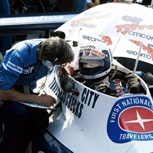 Formula One World Championship: Fifth placed Didier Pironi Tyrrell 008 talks with Ken Tyrrell Tyrrell Team Owner