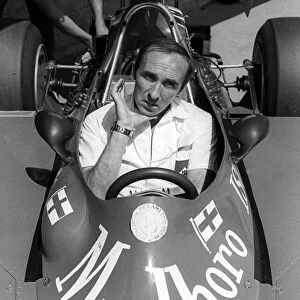 Formula One World Championship: Frank Williams ISO Williams Team Owner sits in one of his race cars