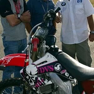 Formula One World Championship: Gonzo and Juan Pablo Montoya Williams take an interest in the motocross bikes at an Alpine Stars event