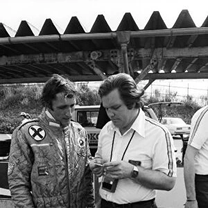 Formula One World Championship: Hans Binder Wolf Williams, who retired from the race on lap 50 with a wheel problem, talks with Patrick Head