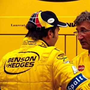 Formula One World Championship: Heinz-Harald Frentzen Jordan talks with his team manager Eddie Jordan