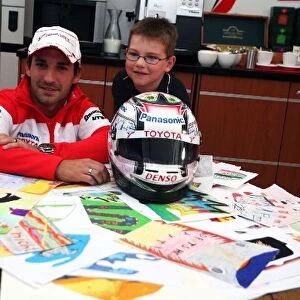 Formula One World Championship: The helmet of Timo Glock Toyota, designed by six year old Tom Luca Hoffman, who presents Timo with it in the