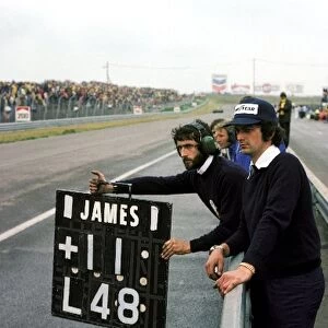 Formula One World Championship: A Hesketh mechanic holds out the pit board from the pit wall for James Hunt, who went on to take his and Hesketh├òs