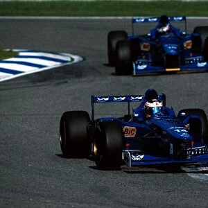 Formula One World Championship: Jarno Trulli Prost AP01, 4th place leads team mate Shinji Nakano Ligier