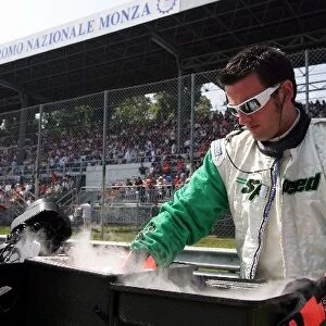 Formula One World Championship: Jordan mechanic with dry ice on the grid