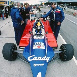 Formula One World Championship: Ken Tyrrell Tyrrell Team Owner beside the car of Derek Daly Tyrrell 010 in the pits