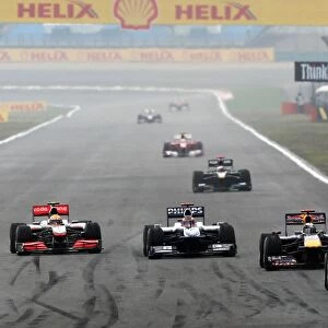 Formula One World Championship: Mark Webber Red Bull Racing RB6 leads Sebastian Vettel Red Bull Racing RB6; Rubens Barrichello Williams FW32