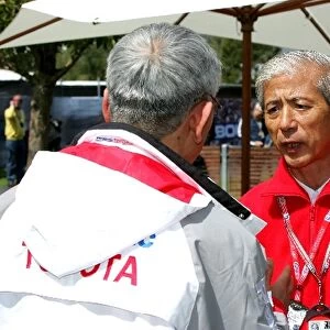 Formula One World Championship: Mr Saito Toyota talks with Tsutomu Tomita Chairman of Toyota Racing and Toyota Team Principal
