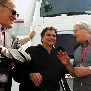 Formula One World Championship: Nelson Piquet shares a joke with Mike Doodson and Giuseppe Allievi Journalist