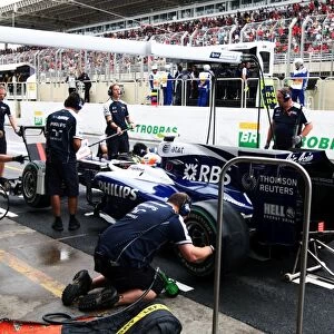 Formula One World Championship: Nico Hulkenberg Williams FW32 changes onto slick tyres en route to taking his first career pole position