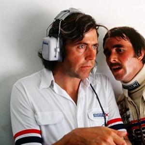 Formula One World Championship: Nigel Mansell, Lotus, right, chats to Peter Wright, Lotus engineer