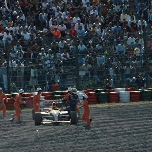 Formula One World Championship: Nigel Mansell walks away from his Wiliams after spinning to retirement after a brake problem