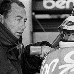 Formula One World Championship: Peter Collins Benetton Team Manager gives final instructions to Jackie Stewart before the former World Champion
