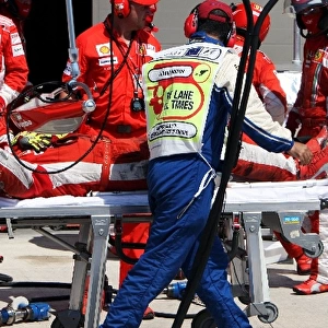 Formula One World Championship: Pietro Timpini Ferrari mechanic is injured during the pit stop of Kimi Raikkonen Ferrari