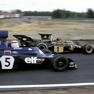 Formula One World Championship: Third placed Emerson Fittipaldi Lotus 72D holds off the race winner Jackie Stewart Tyrrell 006 / 2 as they approach