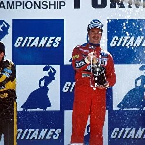Formula One World Championship: The podium: Ayrton Senna Lotus second; Nigel Mansell Williams winner; Stefan Johansson Ferrari third